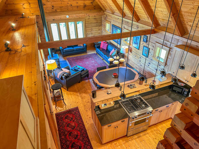 View of the open layout living area from the loft.