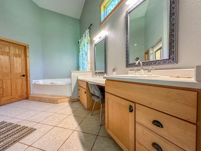 Bathroom 1 has a separate jetted soaker tub and walk-in shower.