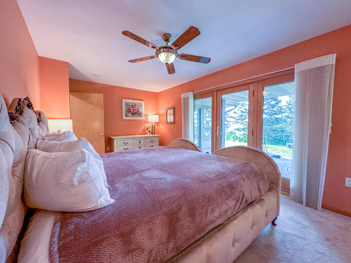 Step out of the doors in bedrooms 1 to get to the second lake-facing patio.