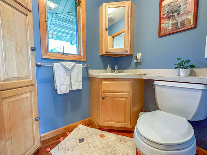 There is a half bathroom located off of the kitchen.