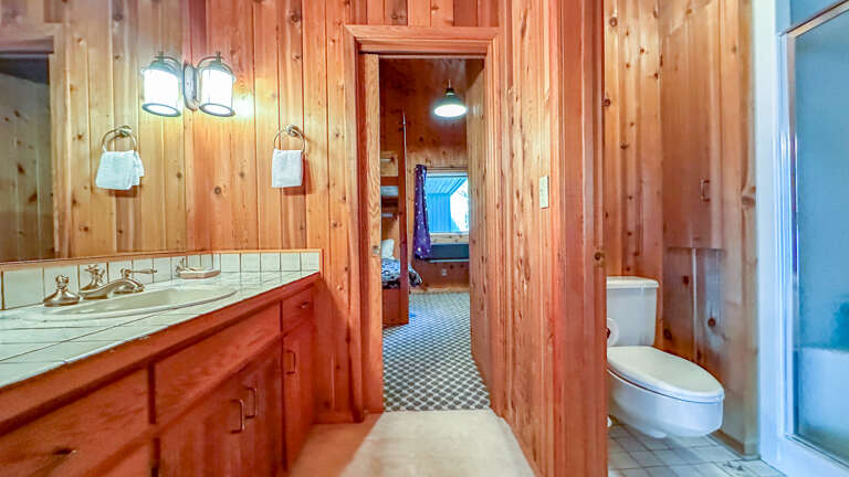 Attached Jack and Jill bathroom located between Bedroom 2 and Bedroom 3.
