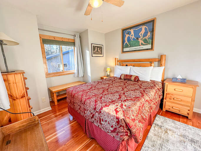 The bedroom features a queen sized bed.