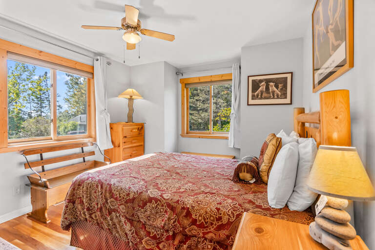Main floor bedroom overlooking forest.