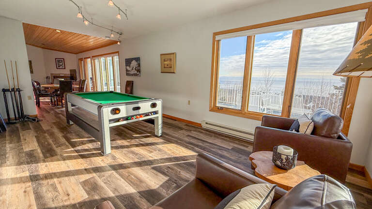 The game room is located off of the living area.