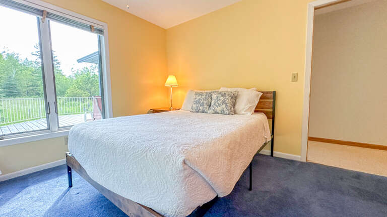 Queen bed in Bedroom 2.