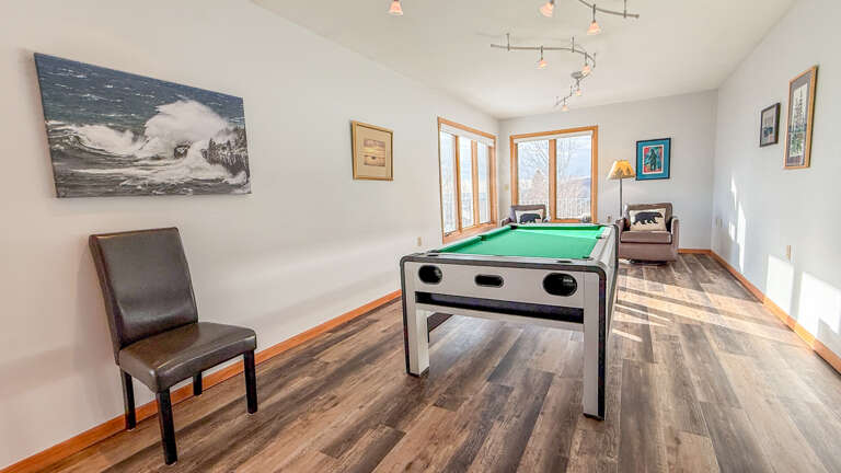 The pool table also converts into a ping pong table.