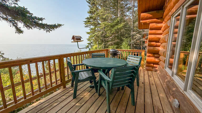 Your private deck overlooks Lake Superior's pristine waters, perfect for morning coffee or evening sunsets. The log cabin's warm, natural charm invites you to unwind in peaceful seclusion.