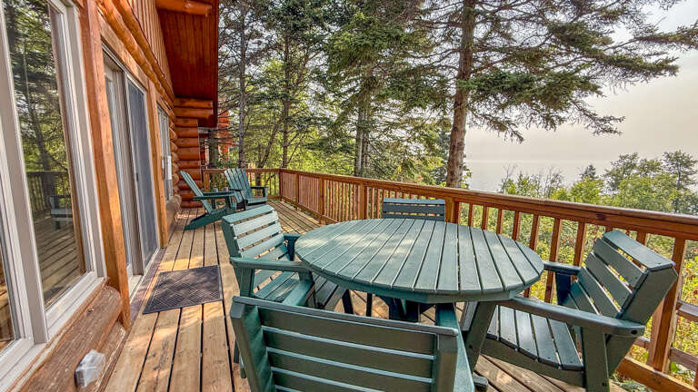 Step outside to your private deck where forest views and fresh mountain air greet you. Gather around the outdoor table for morning coffee or evening meals, surrounded by towering pines and peaceful natural beauty.