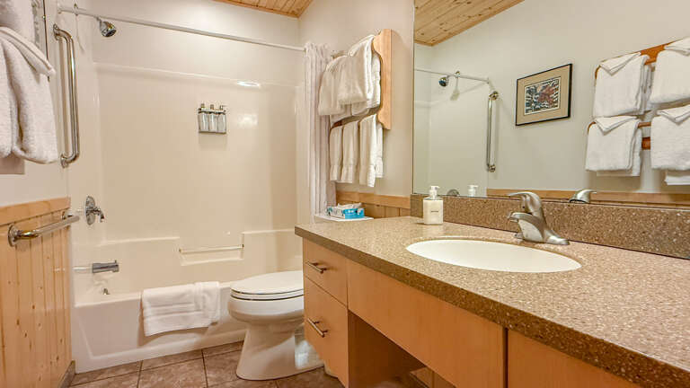 Refresh after your mountain adventures in this bright, well-appointed bathroom. Fluffy towels, a relaxing tub-shower combo, and plenty of counter space make unwinding effortless.