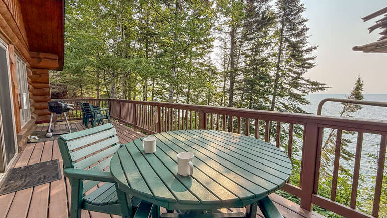 Start your morning with coffee on your private deck overlooking tranquil waters, surrounded by towering pines and the peaceful sounds of nature.
