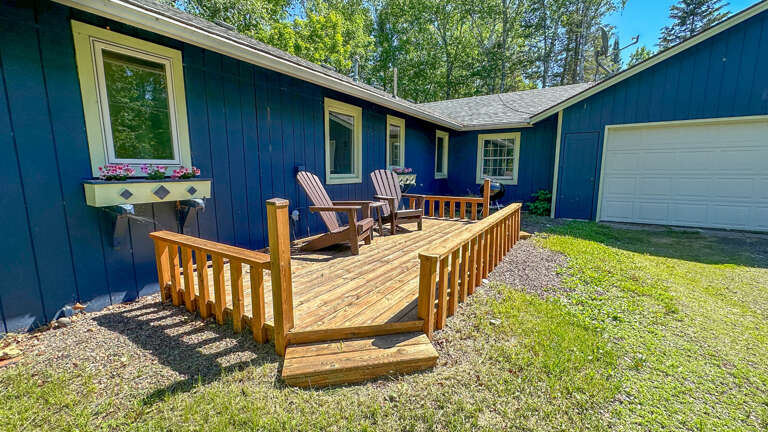 The home has two decks with seasonal furniture.