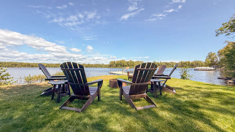 Lakefront oasis with Adirondack chairs and private dock overlooking peaceful watersâperfect for sipping morning coffee or evening cocktails as the sun sets over the horizon.