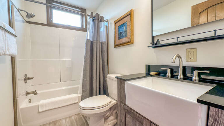 The second bathroom, located in the bedroom hallway, has a shower/tub combo. The second bathroom, located in the bedroom hallway, has a shower/tub combo.