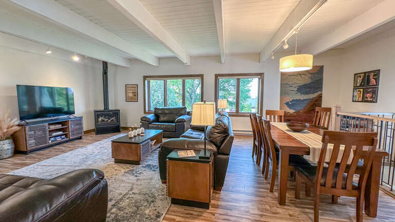 The living room and dining room in the open-layout living area. The living room and dining room in the open-layout living area.