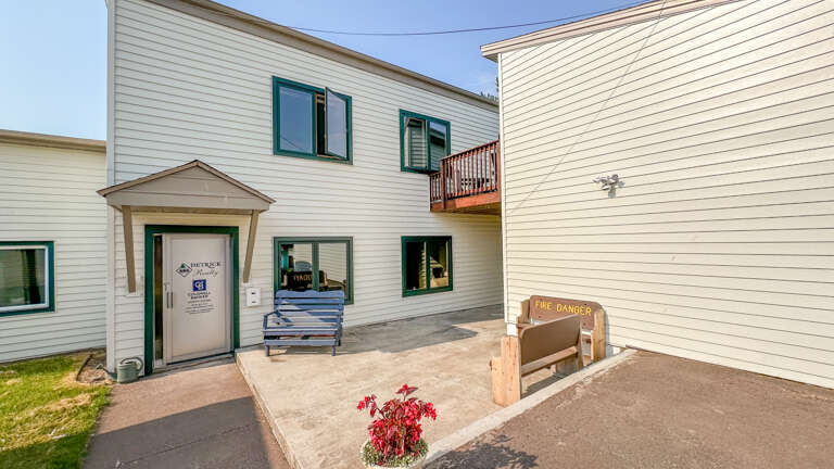 The rental includes a dedicated parking area behind the building and the apartment takes up. the upper floor.