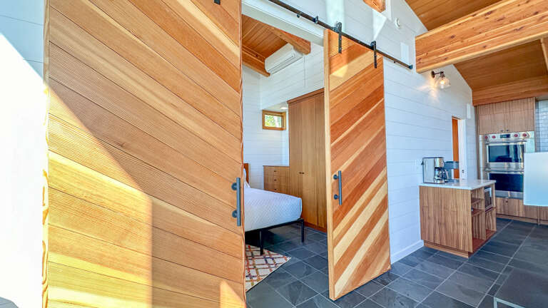 Bedroom 1 has barn doors for easy opening/closing.