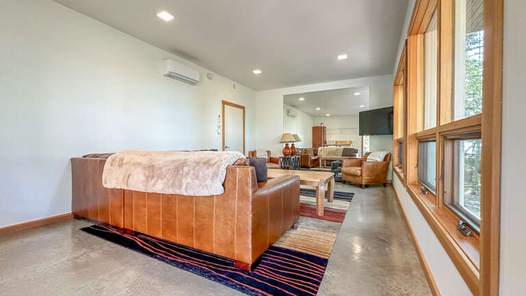 The family room is located on the lower level and has a TV and AC.