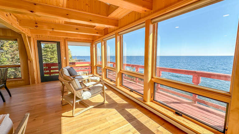 Floor-to-ceiling windows in the living area.