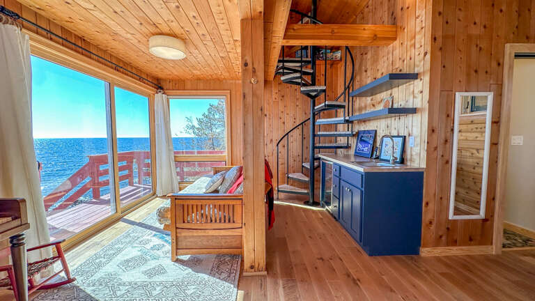 Head up the spiral staircase to the sleeping area in the Kids Cabin.