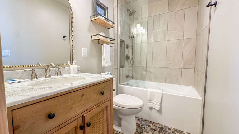 Bathroom 3 is in the Kids Cabin and has a shower/tub combo.