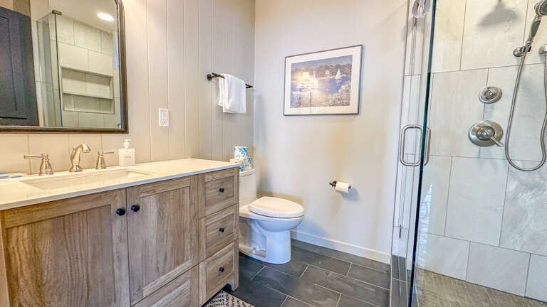 Bathroom 2 is in the main cabin and has a glass-surround walk-in shower.