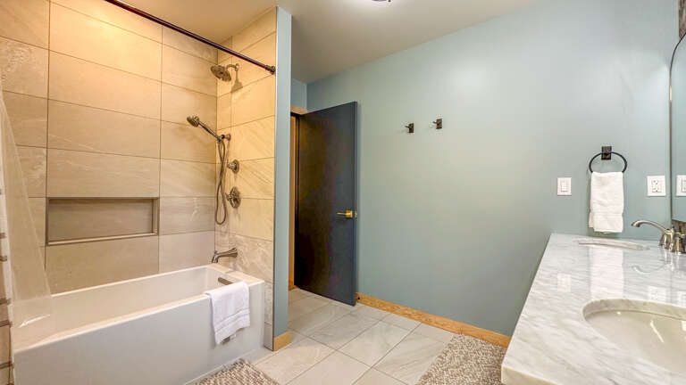 Shower/tub in Bathroom 1.