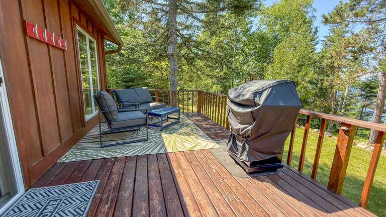 Grill and sitting area on the deck.