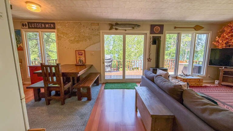 The open layout living area includes a living room, dining area, and kitchen.
