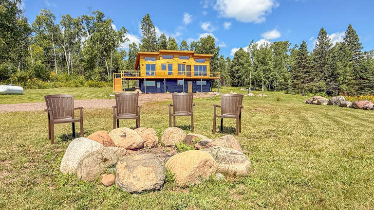 Spend precious time with friends and family at the Cross River Cabin fire pit and yard area.