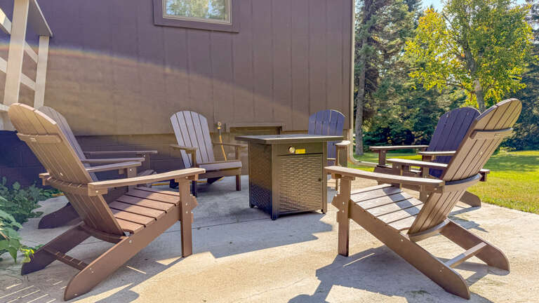 Outside you will find a gas-powered fire pit and plenty of seating.