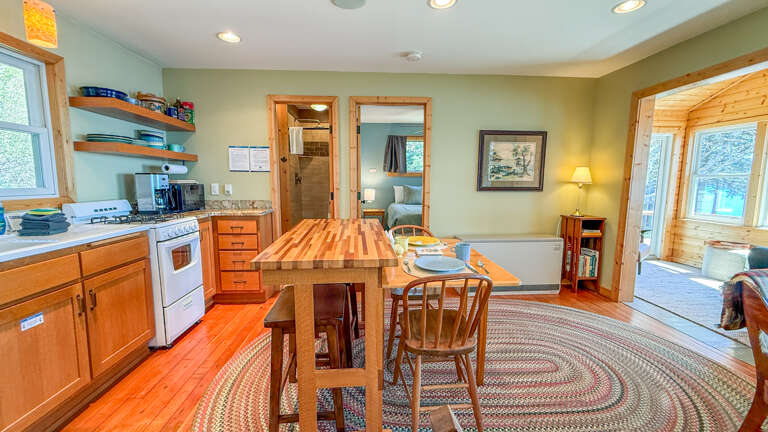 Gather around the handcrafted butcher-block island in your fully equipped kitchen, where warm wood tones and open sightlines invite easy conversation while you cook and unwind together.