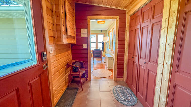 Step into your cozy cabin retreat where warm wood tones and thoughtful storage welcome you home after your adventures.