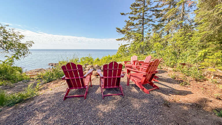Settle into these cozy Adirondack chairs and let the calming lake views and fresh pine-scented air melt your stress away as you sip your morning coffee.