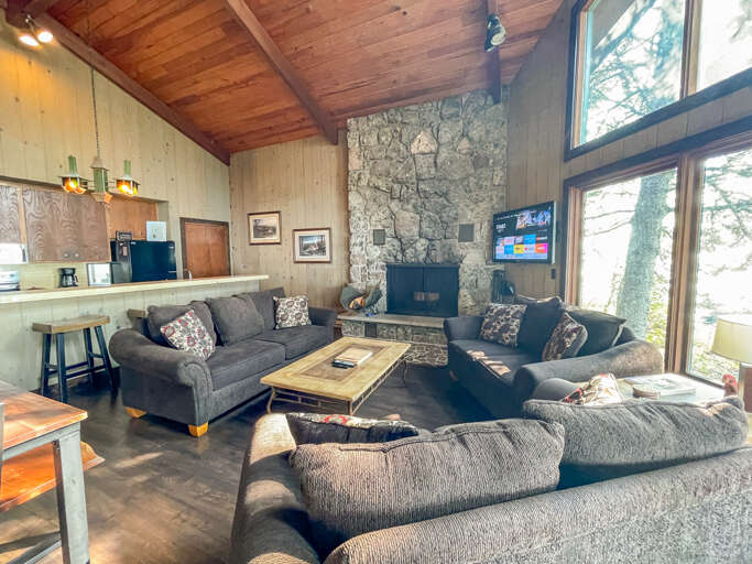Sink into plush sofas around the stone fireplace, stream your favorites on the big screen, and let your eyes drift to serene views through soaring windows.