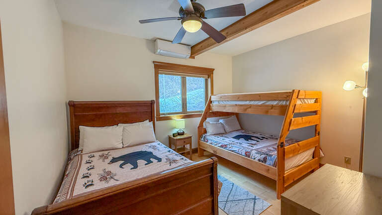 Sleep peacefully in your cozy bedroom featuring two double beds. Please note that the top bunk is not available.