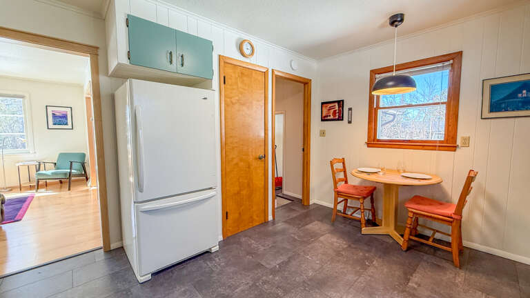Your cozy kitchen nook features everything you need, with charming wooden chairs perfect for morning coffee and meals together.