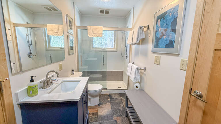 Your private ensuite bathroom features a spacious walk-in shower, modern vanity, and thoughtful amenities for a refreshing start to each day.