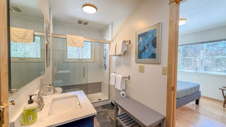Your spa-like ensuite offers a luxurious glass shower and peaceful forest views to start each morning refreshed.