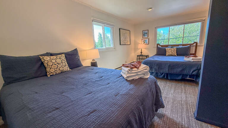 Sink into your comfortable beds after a day of exploring, with fresh towels and natural light streaming through the windows.