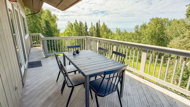 Your private terrace offers a peaceful retreat surrounded by lush greenery. Sip morning coffee or enjoy an outdoor meal while taking in the serene, tree-lined views stretching toward the horizon.