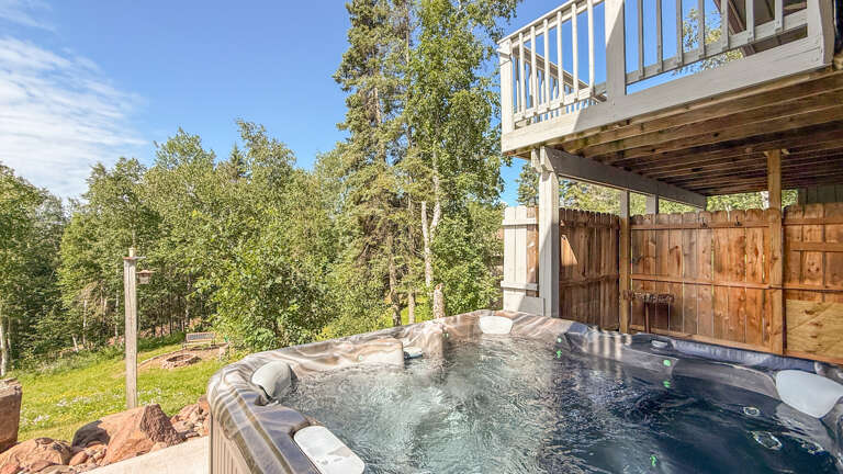 Soak in your own private hot tub surrounded by towering aspen trees and mountain airâa perfect spot to unwind after a day of adventure.