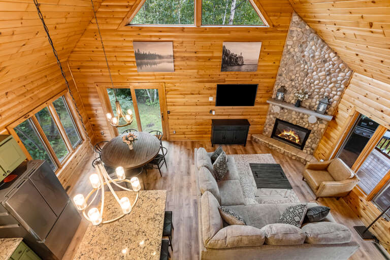 The great room will wow you with its modern furnishings, gorgeous views of your private backyard retreat.