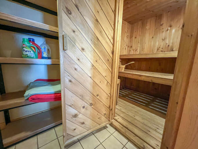 Next to the washer and dryer is the sauna.