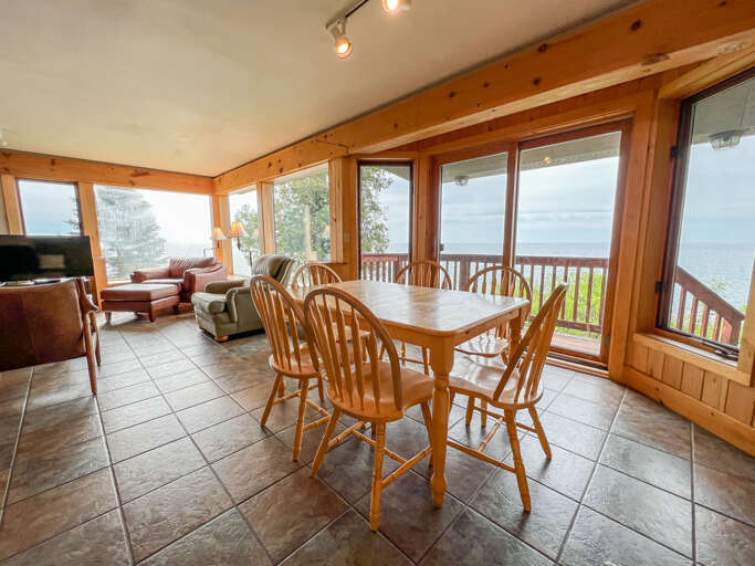 A wall full of windows welcomes in the Lake Superior views. A wall full of windows welcomes in the Lake Superior views.