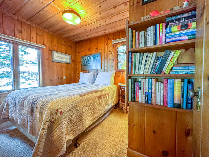 Bedroom 1 with a small library of books to enjoy.