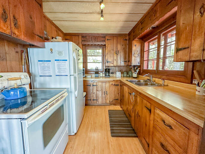 The kitchen features beautiful custom cabinetry.