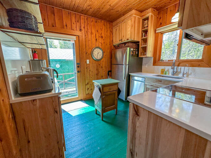 The newly renovated kitchen features stainless steel appliances.