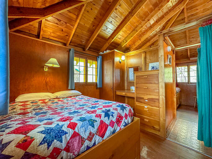 Bedroom 2 has a full sized bed and built in desk.