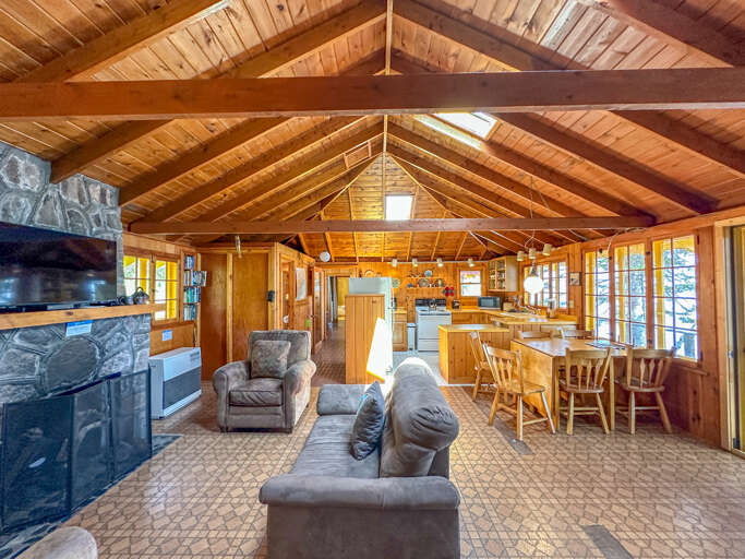 The kitchen and dining area are located off of the living room.