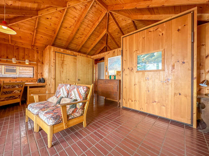 The Murphy bed is pictured on the right, in the up position.